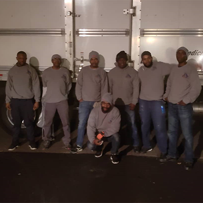 OCL Moving Inc. Group Photo at night
